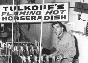 Marty Tulkoff, son of Harry and Lena, inspects a product line while its running Tulkoff's famous Hot Horseradish.