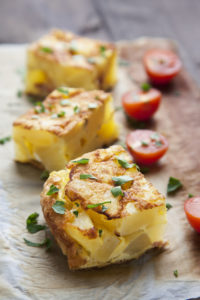 potato frittata with tomatoes and parsley raw